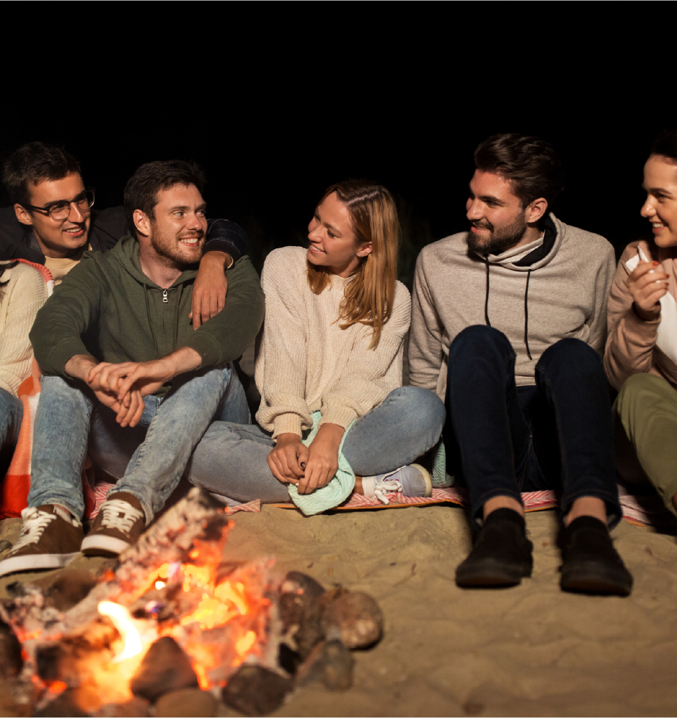 People gathering around fire - Safe Space for Honest Dialogue