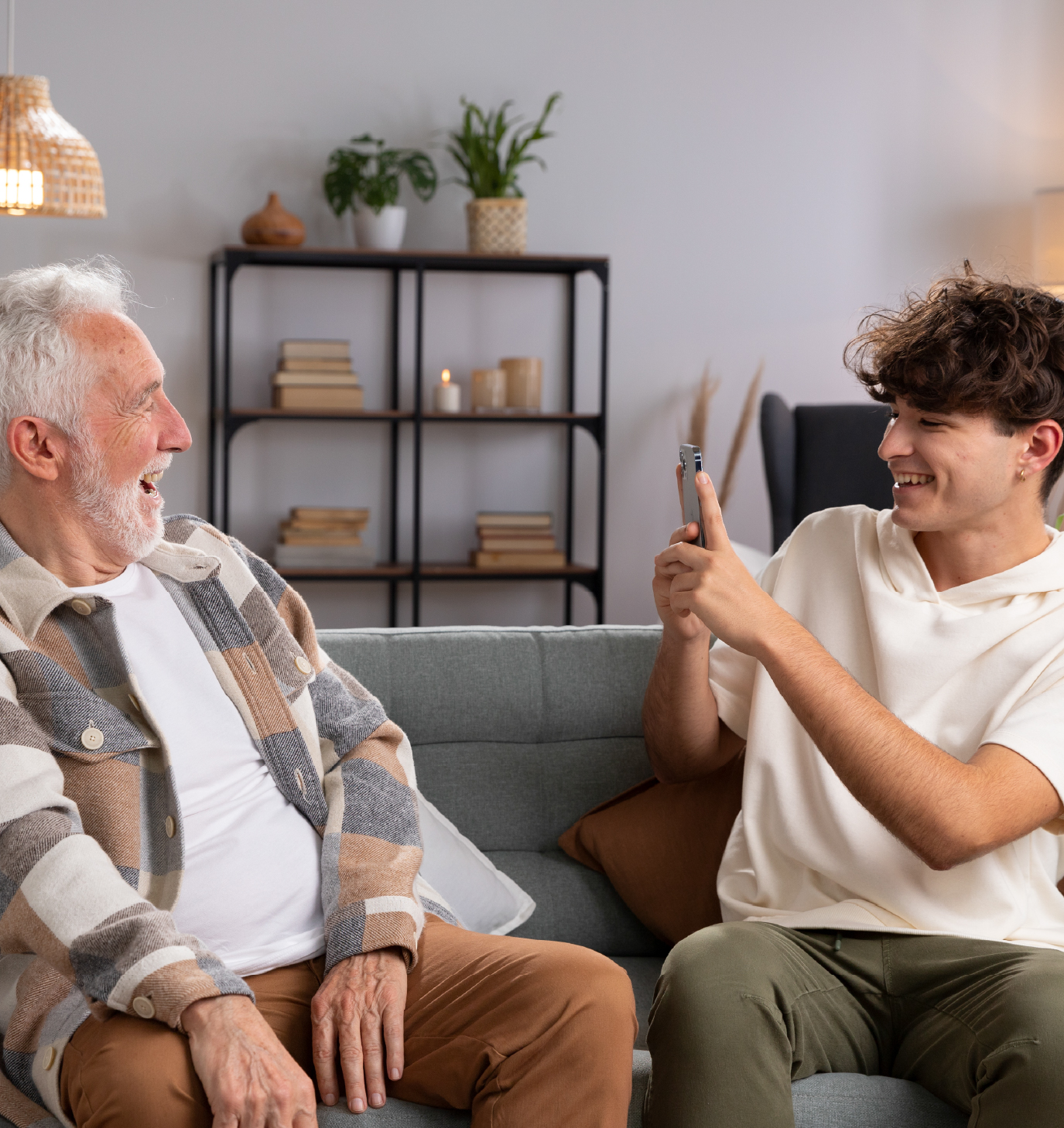 Young guy taking photo of grandfather - Unique Every Time